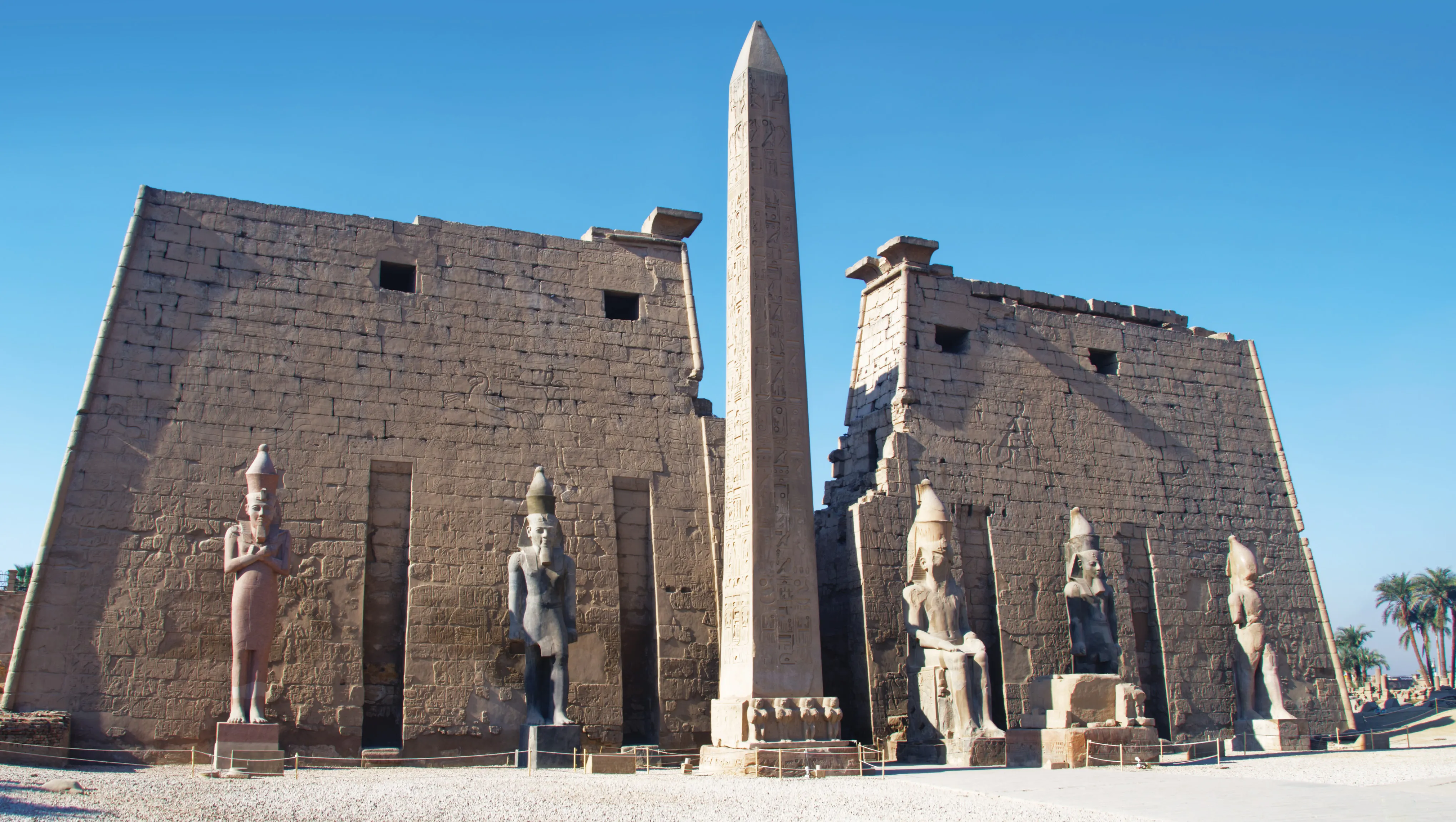 Historic Luxor Temple entrance with towering obelisks